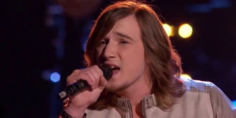 Morgan Wallen during a performance on The Voice, showcasing his vocal talent and charisma.