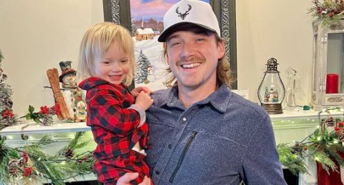 Morgan Wallen holding his son, Indigo Wilder, highlighting the personal side of the artist's life as a father.